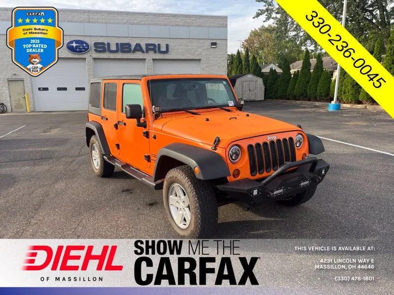 Used 2013 Orange Jeep Unlimited Sport image 1