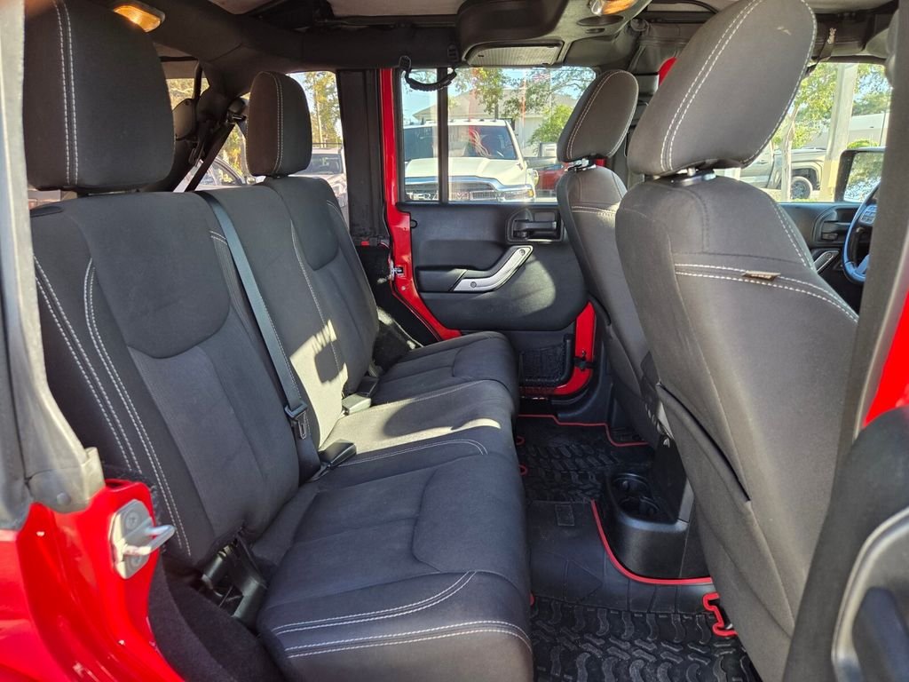 Used 2015 Red Jeep Unlimited Sahara image 15