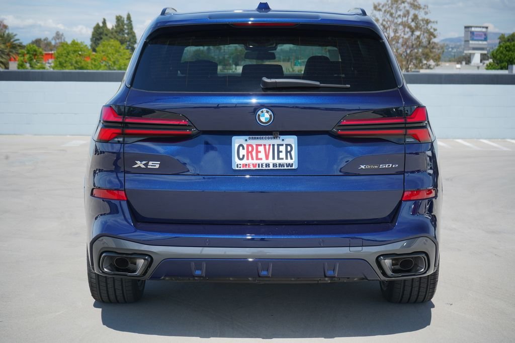 New 2026 Tanzanite Blue II Metallic BMW xDrive50e image 7