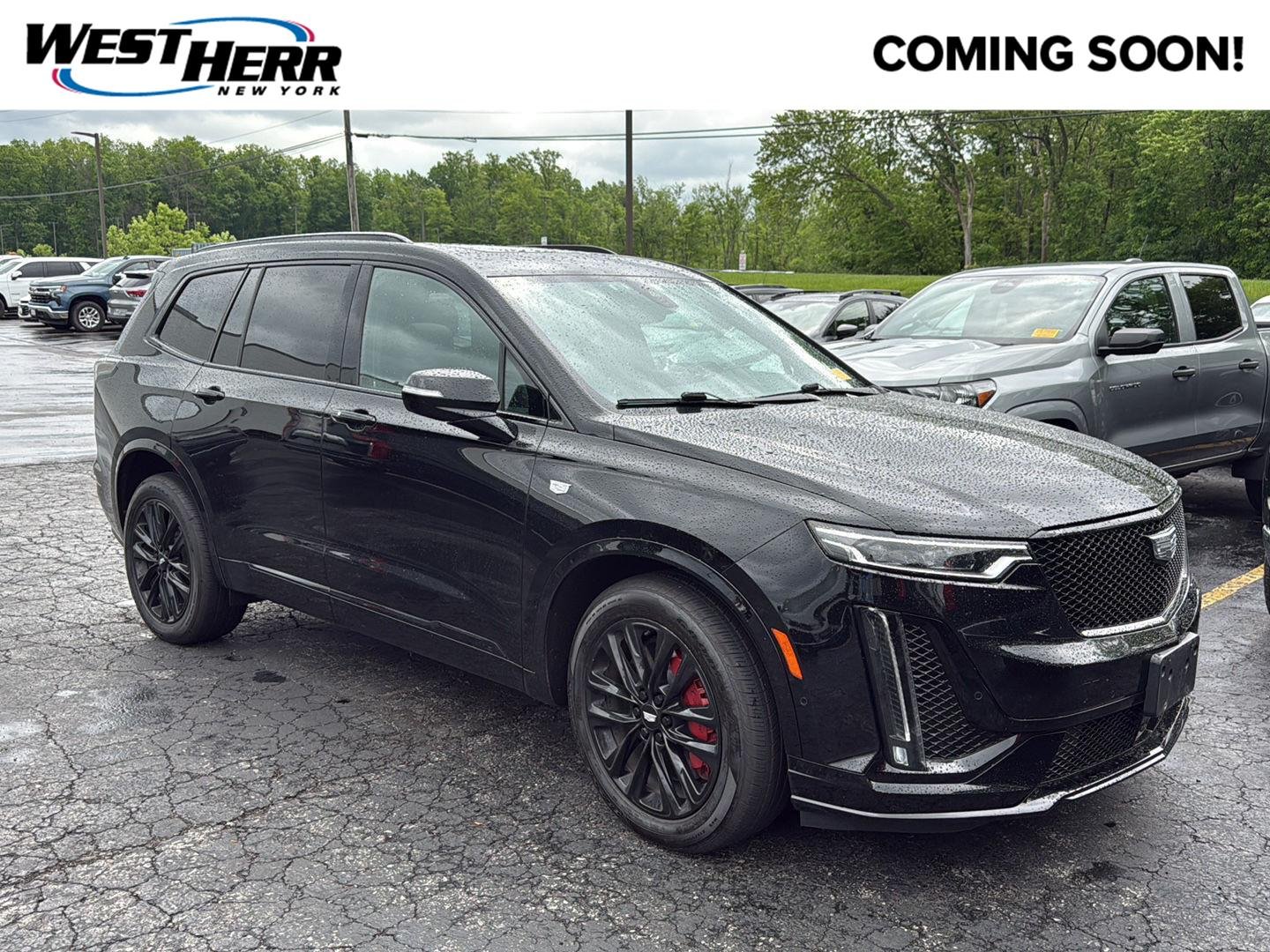 Used 2023 Stellar Black Metallic Cadillac AWD Sport image 1