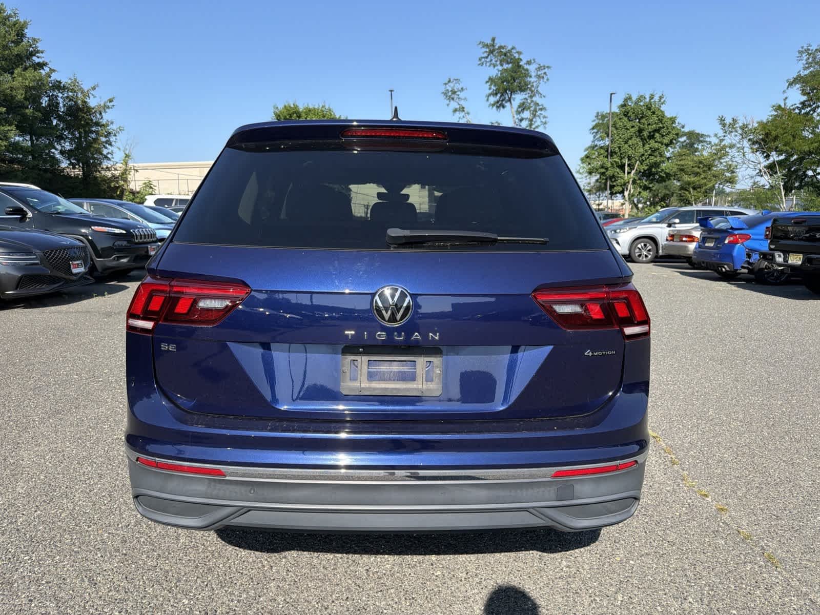 Used 2022 Atlantic Blue Metallic Volkswagen SE image 4