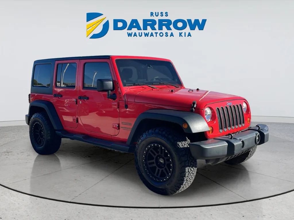 Used 2013 Red Jeep Unlimited Sport image 7