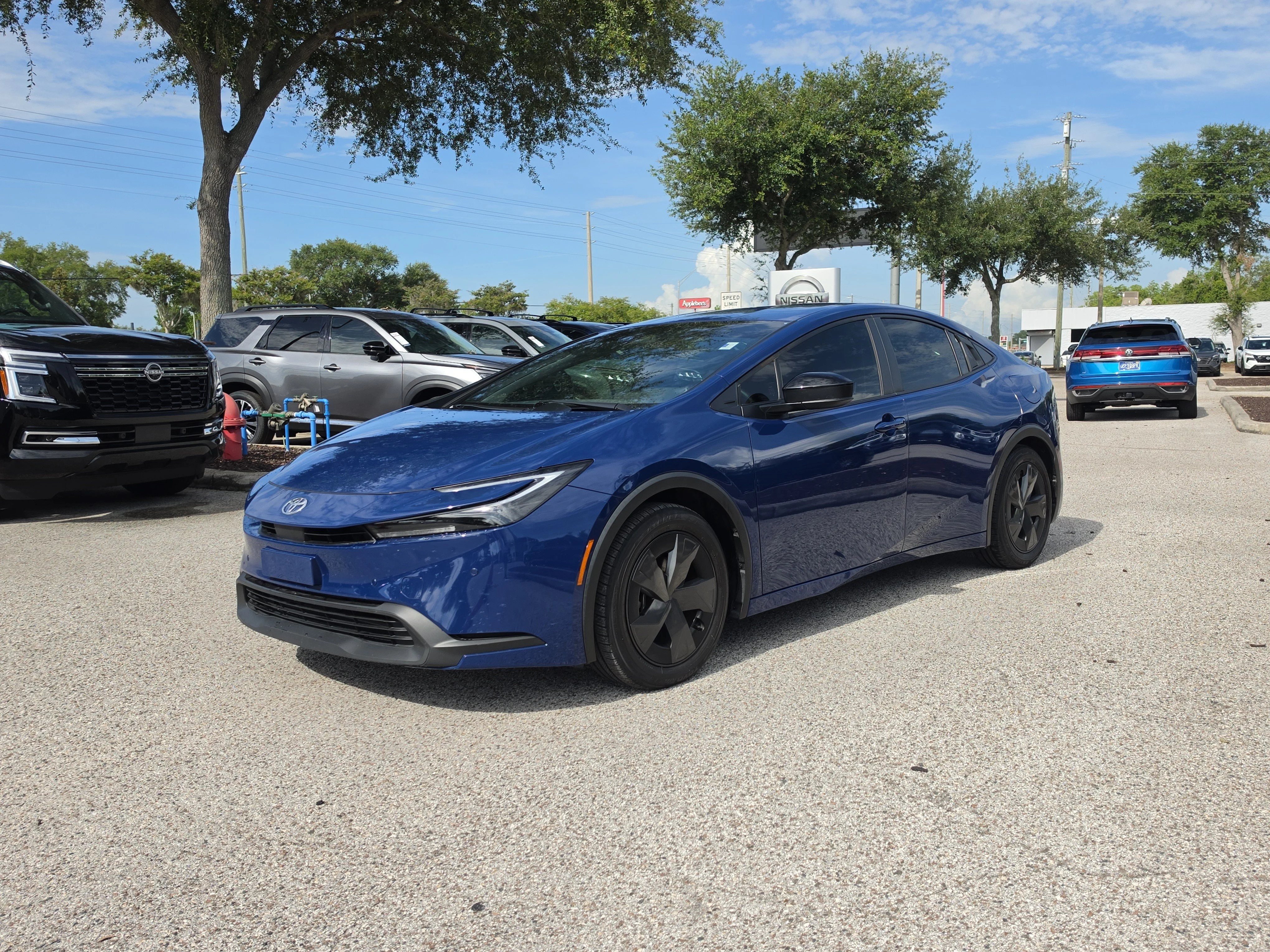 Used 2024 Reservoir Blue Toyota LE image 4