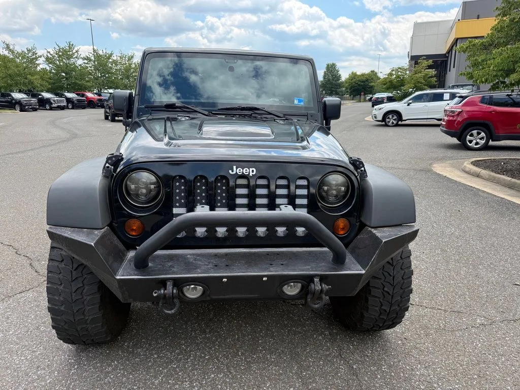 Used 2011 Black Jeep Unlimited Sport image 2