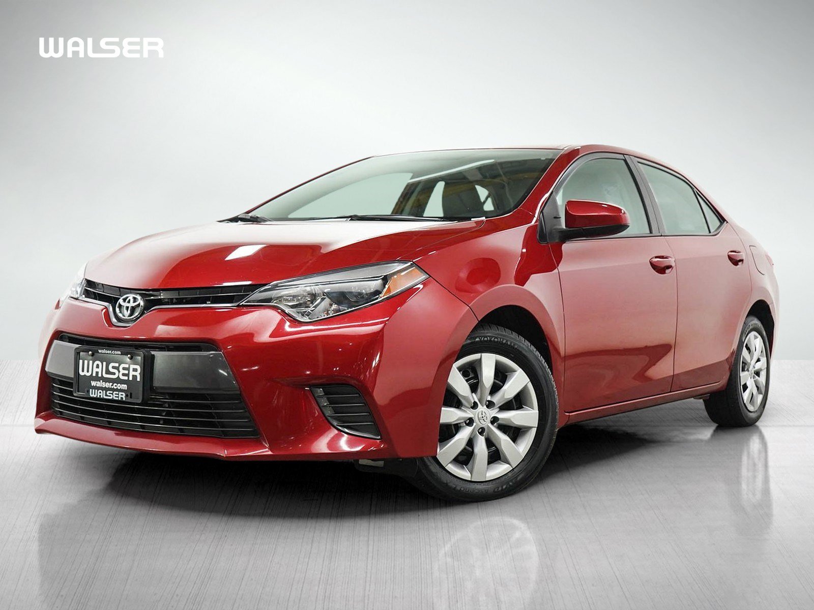 Used 2016 Barcelona Red Metallic Toyota LE image 1