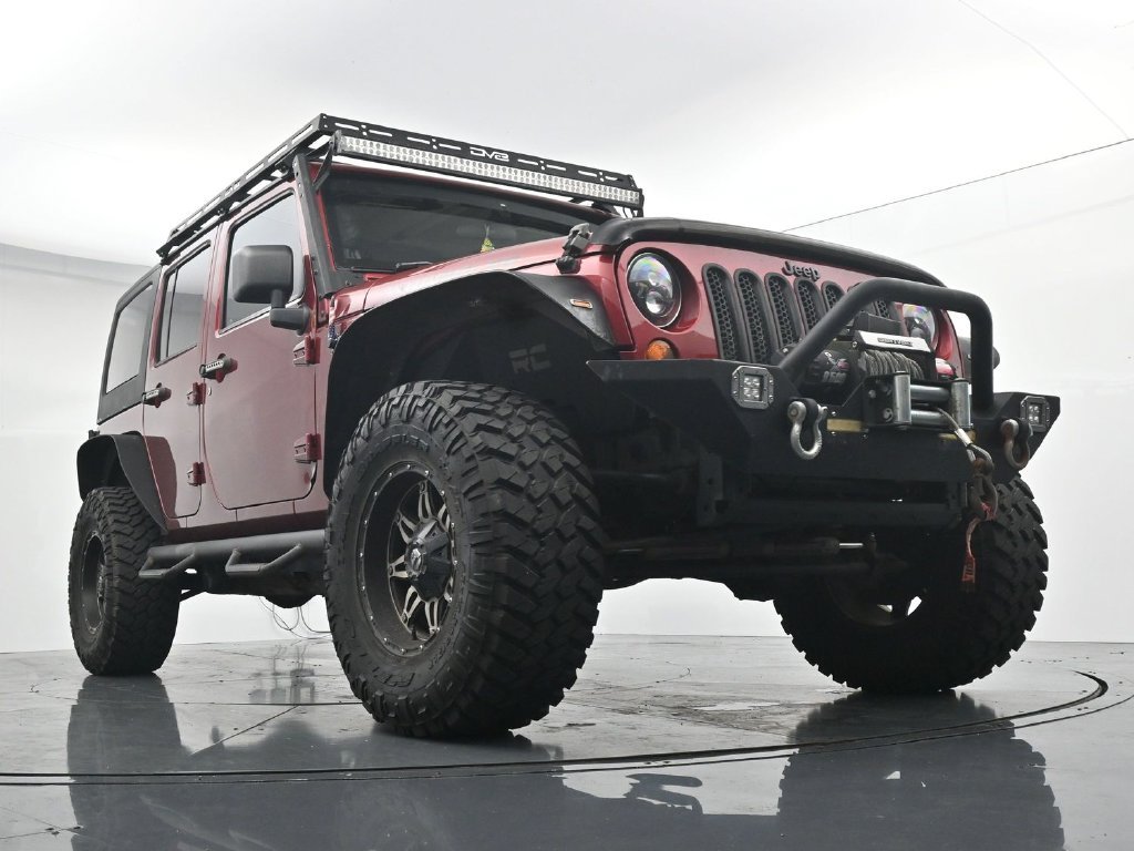Used 2012 Red Jeep Unlimited Sport image 18