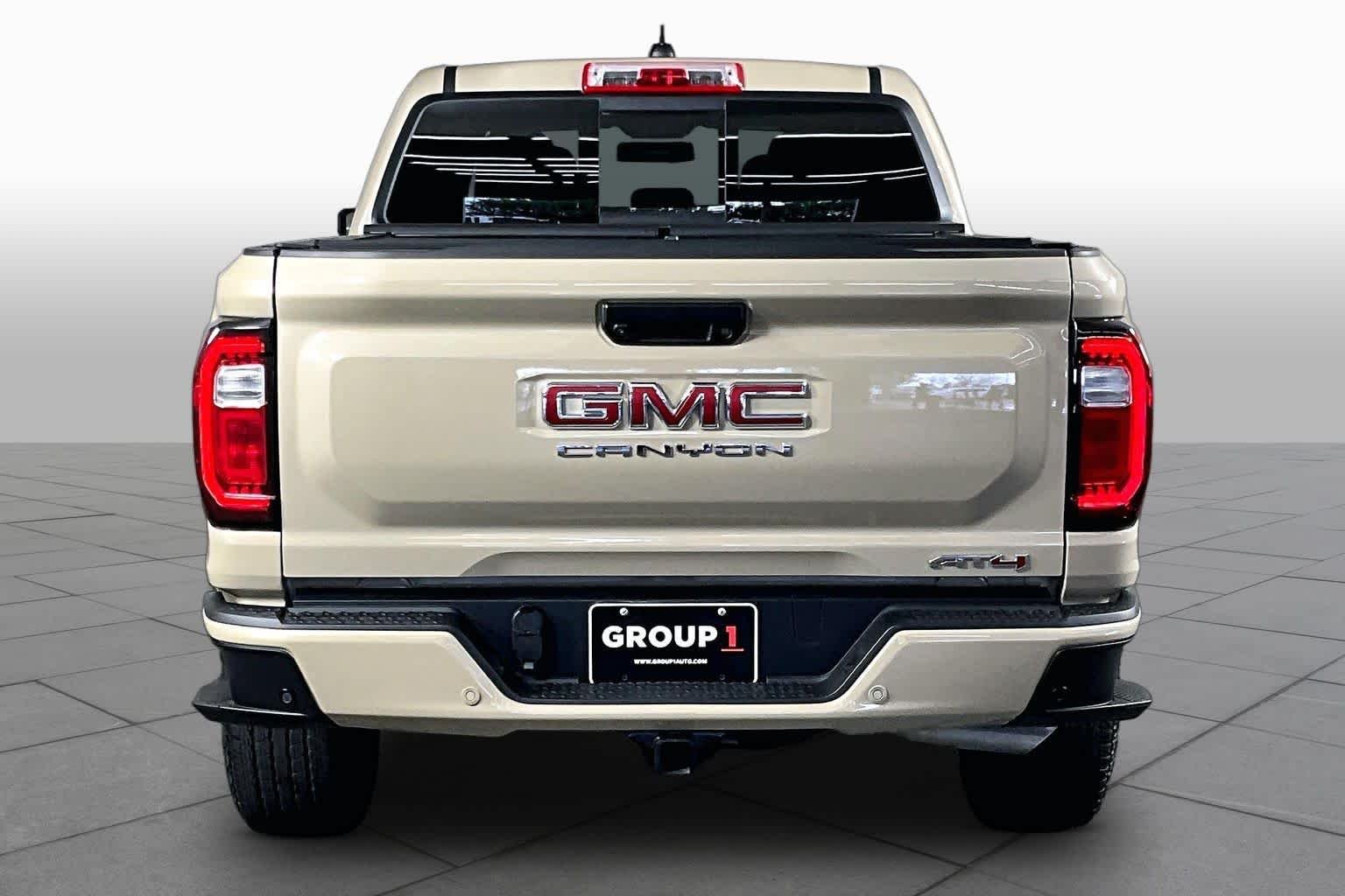 Used 2024 Desert Sand Metallic GMC 4WD AT4 image 5