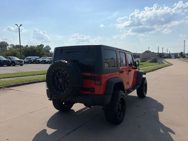 Used 2015 Orange Jeep Unlimited Sport image 5