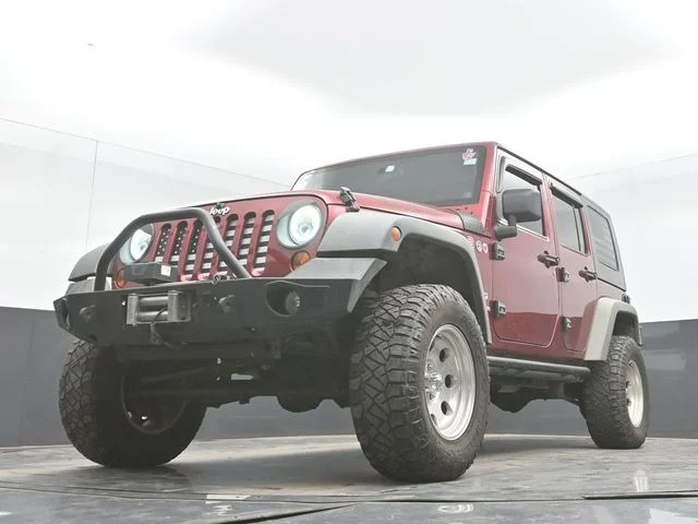 Used 2012 Red Jeep Unlimited Sport image 27