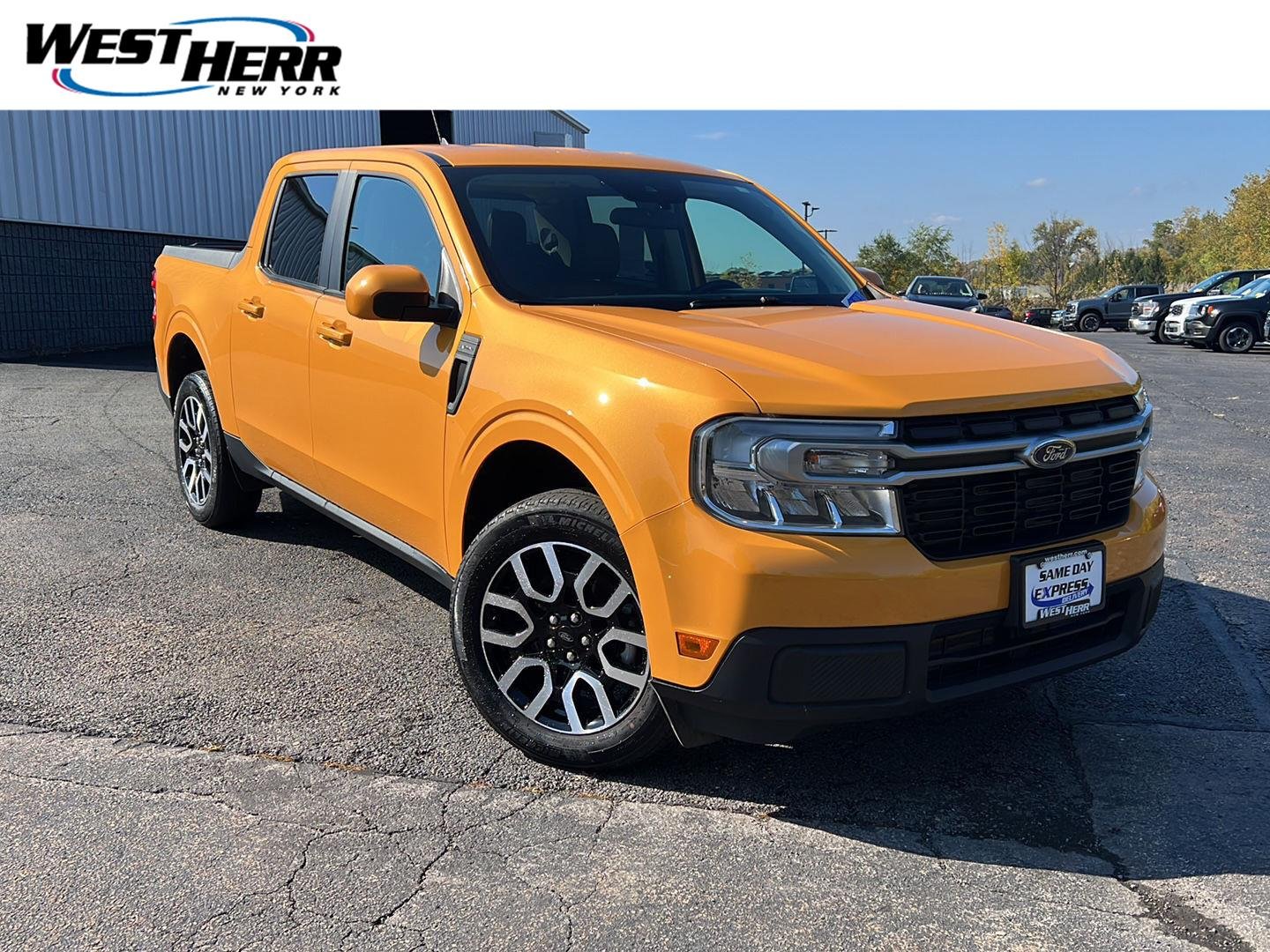 Used 2023 Cyber Orange Metallic Tri-Coat Ford LARIAT image 1