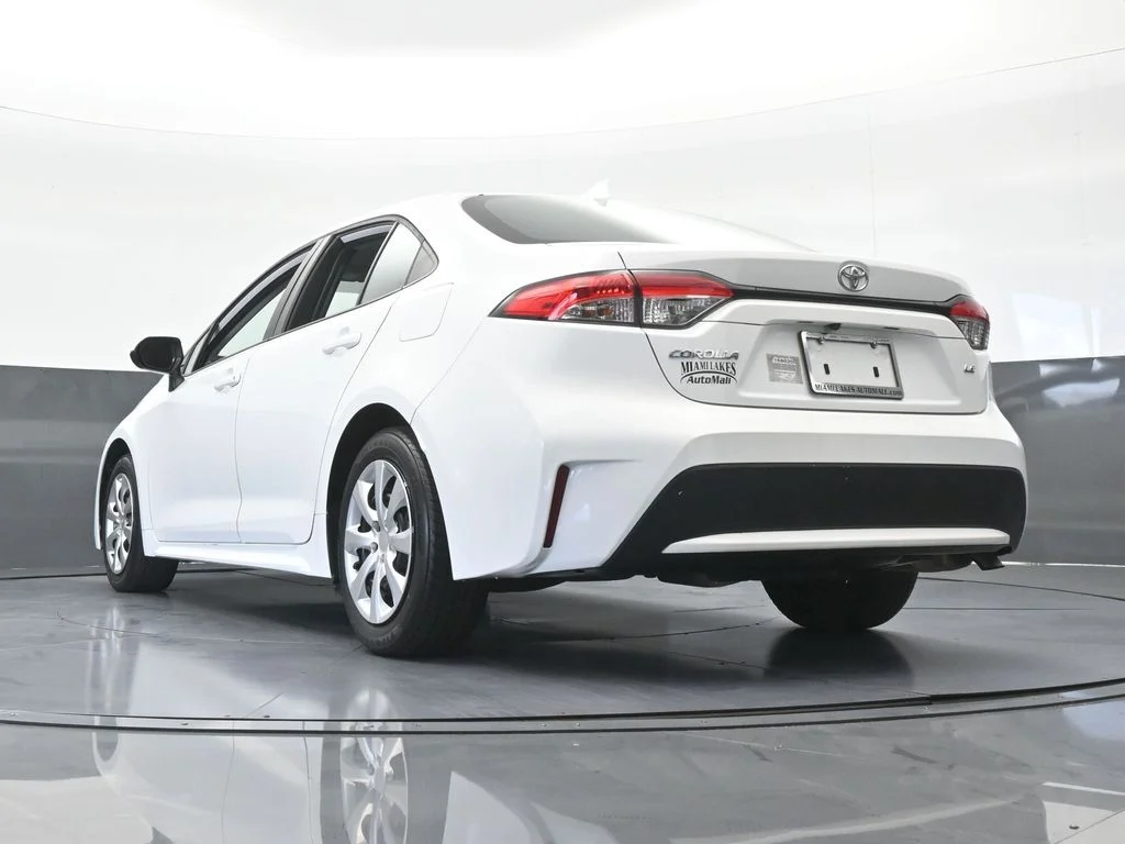 Used 2021 Super White Toyota LE image 47