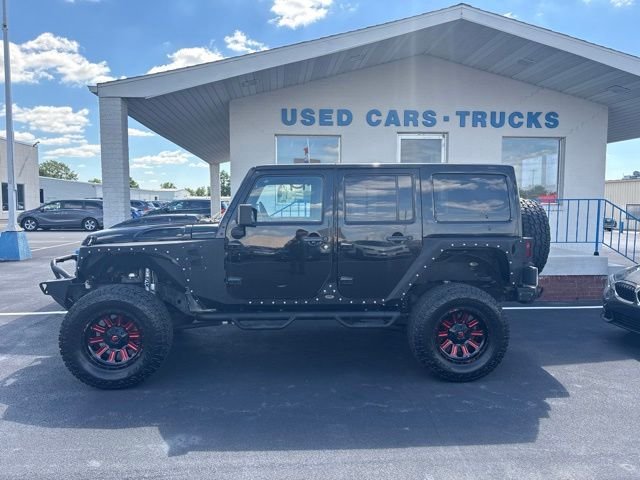 Used 2013 Black Jeep Unlimited Sahara image 4