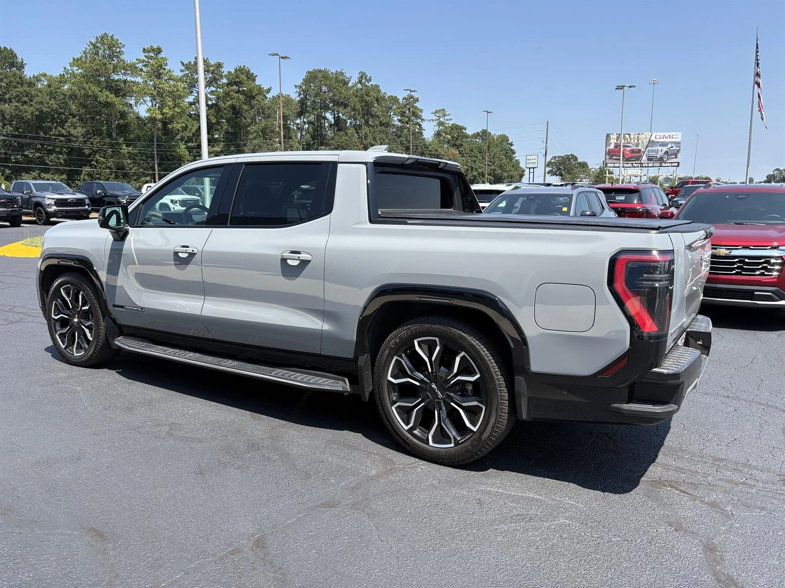 Used 2025 Thunderstorm Gray GMC Max Range Denali image 9