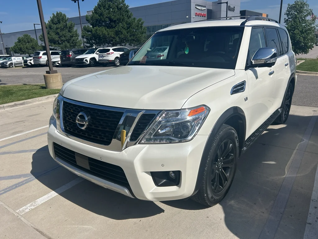 Used 2017 Pearl White Nissan Platinum image 1