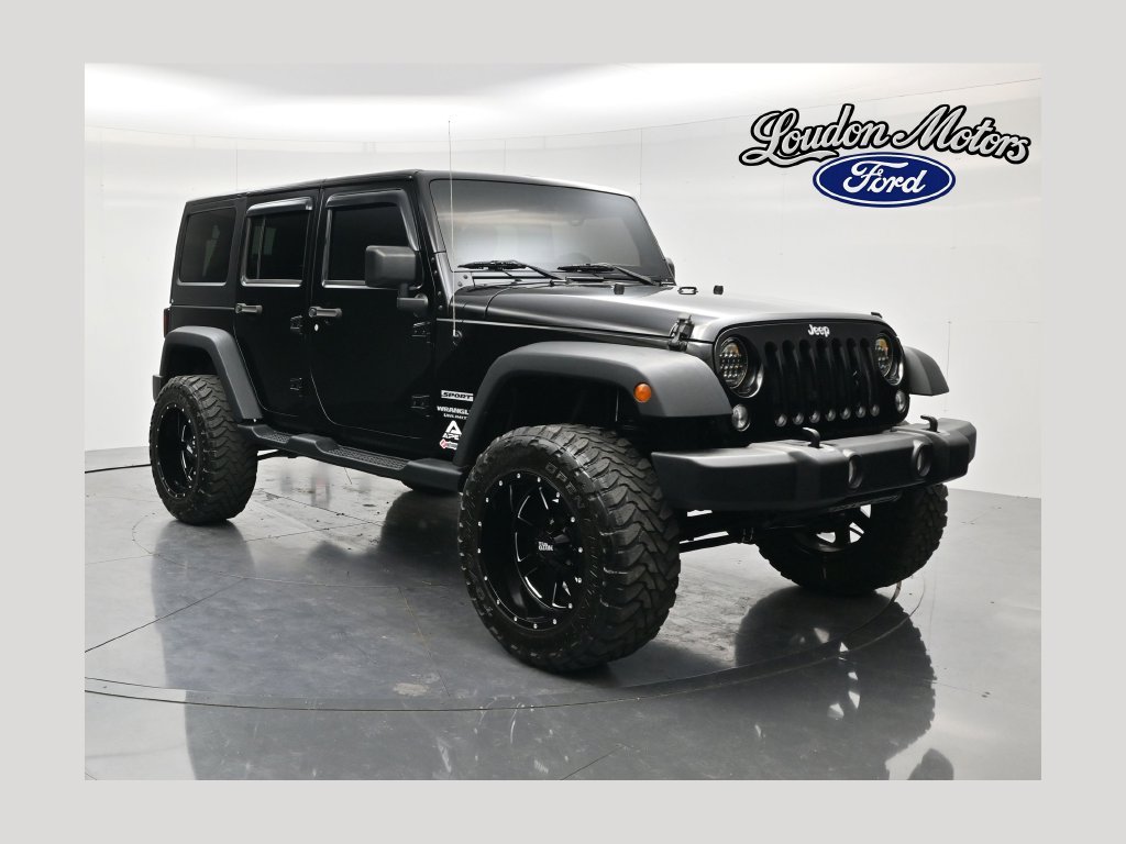 Used 2014 Black Clearcoat Jeep Unlimited Sport image 1