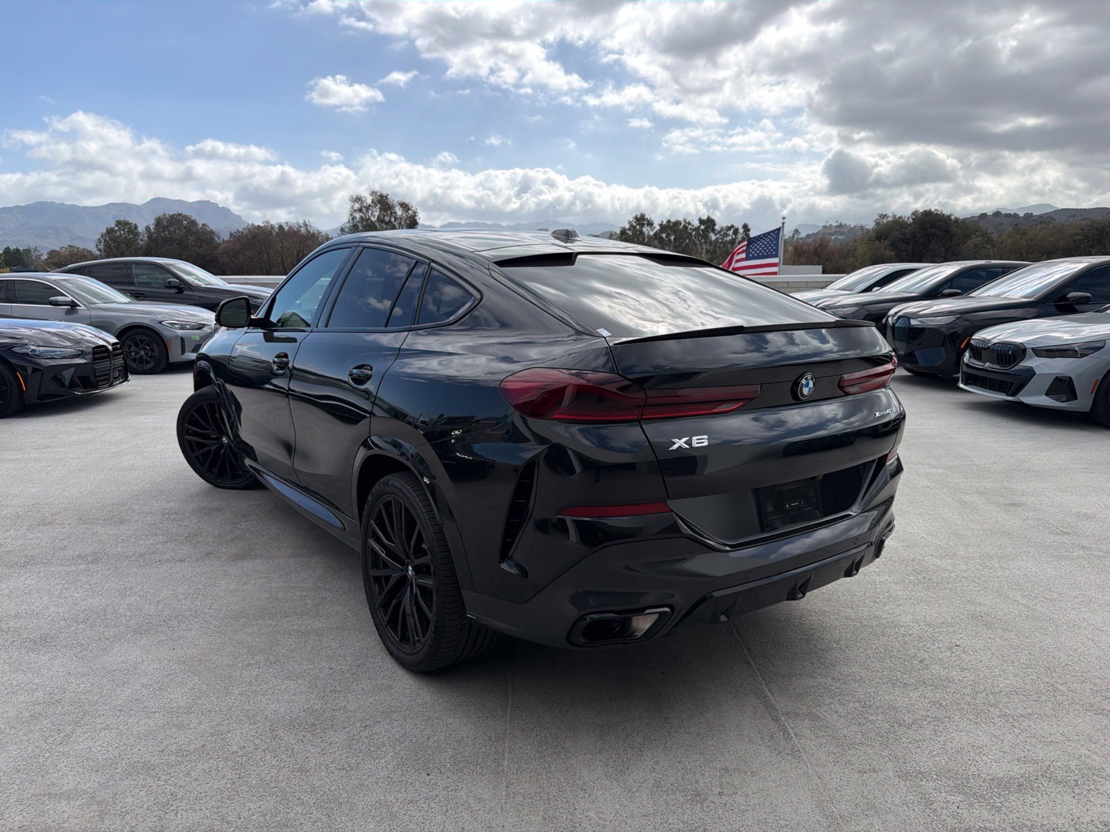 Certified Used 2024 Black Sapphire Metallic BMW xDrive40i image 2