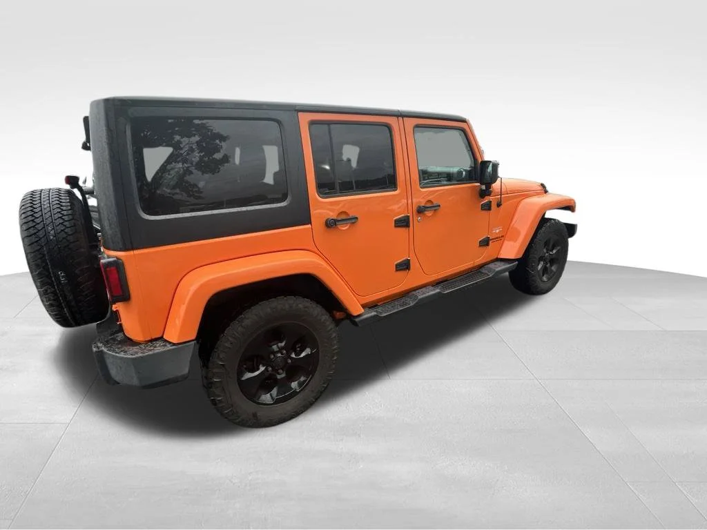 Used 2013 Orange Jeep Unlimited Sahara image 12