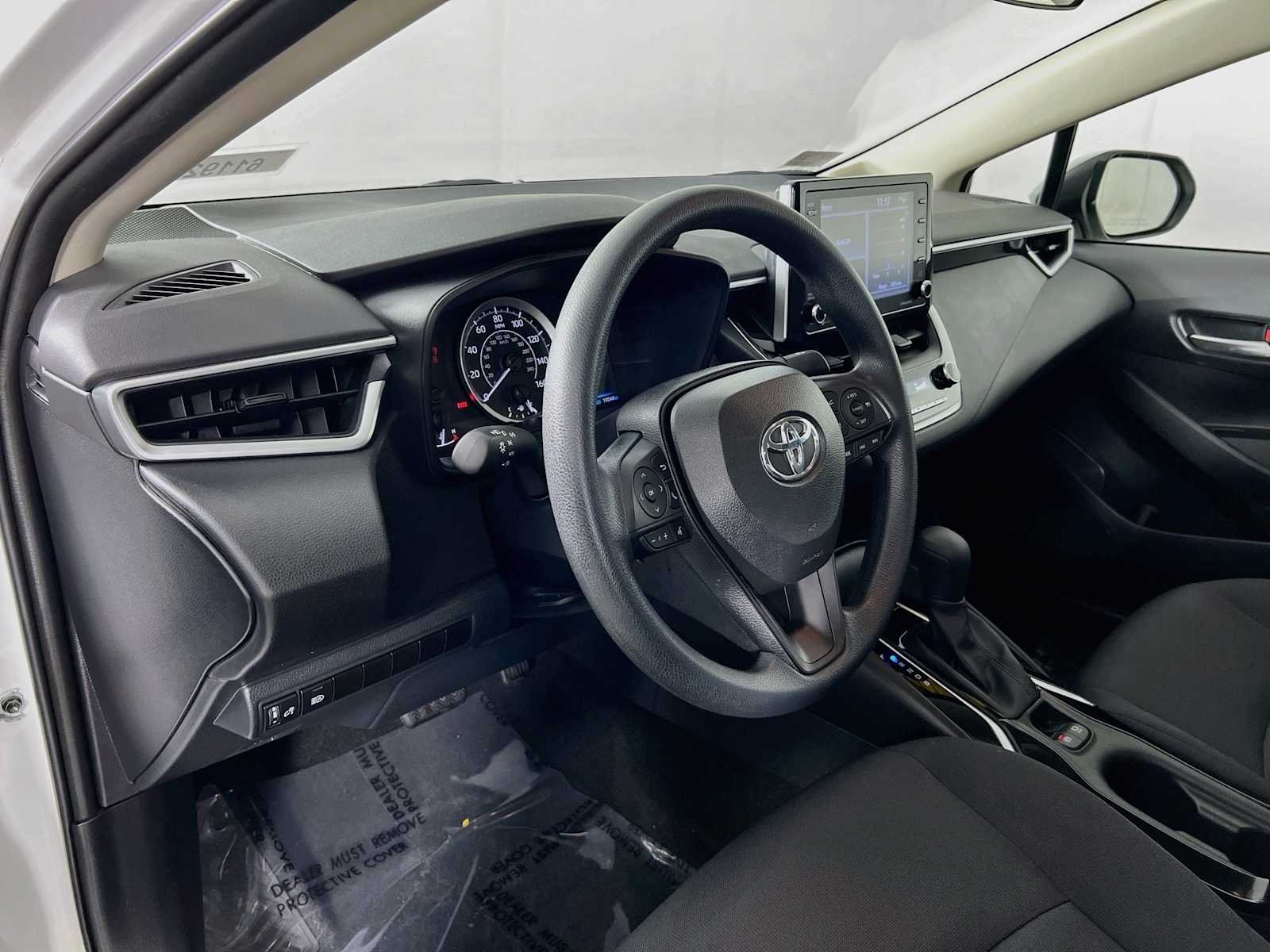 Used 2021 Super White Toyota LE image 9