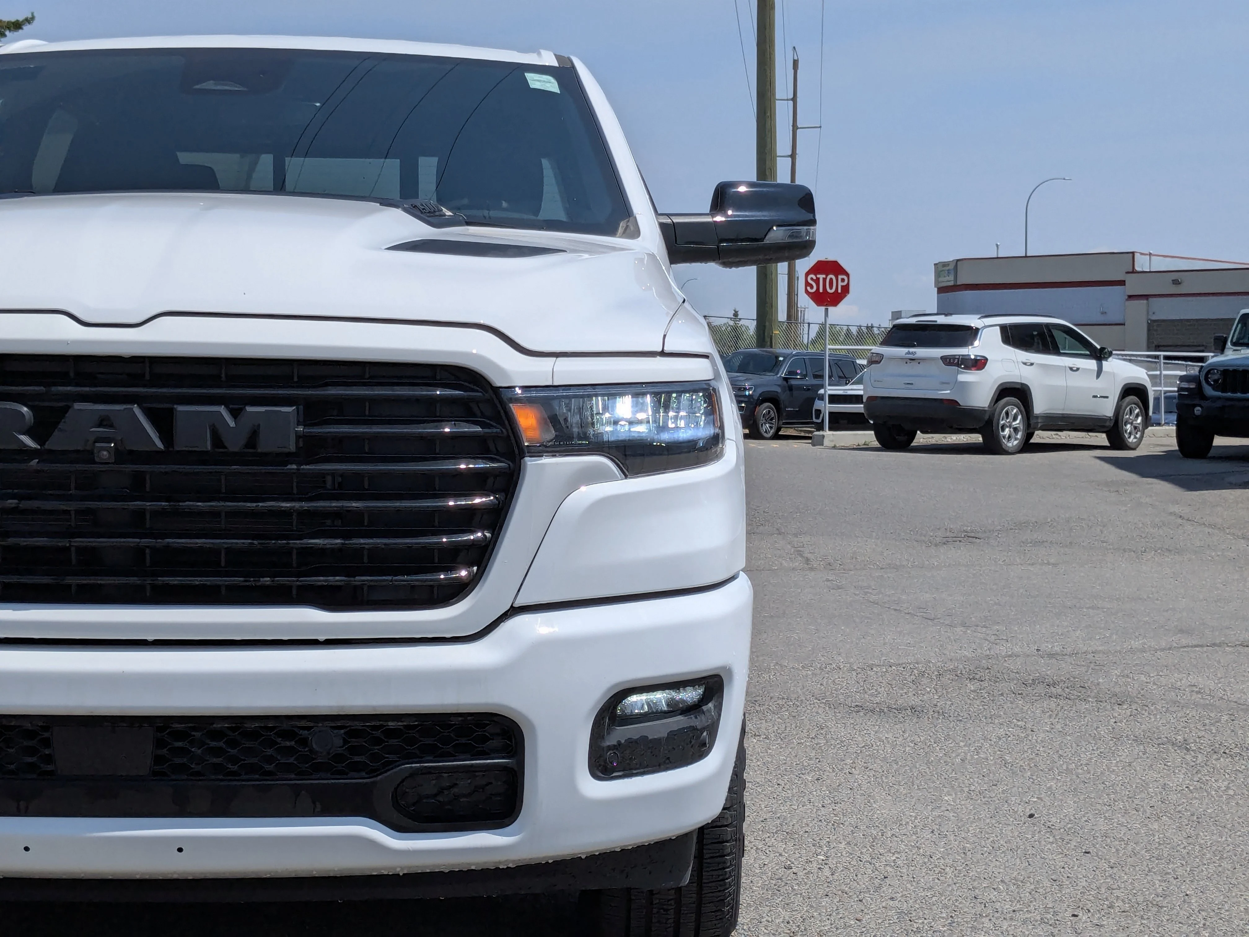 New 2026 White RAM Sport - 3.92 Rear Axle Ratio - Anti Spin Rear Diff - Sport Hood - Panoramic Sunroof & Tons More! image 9
