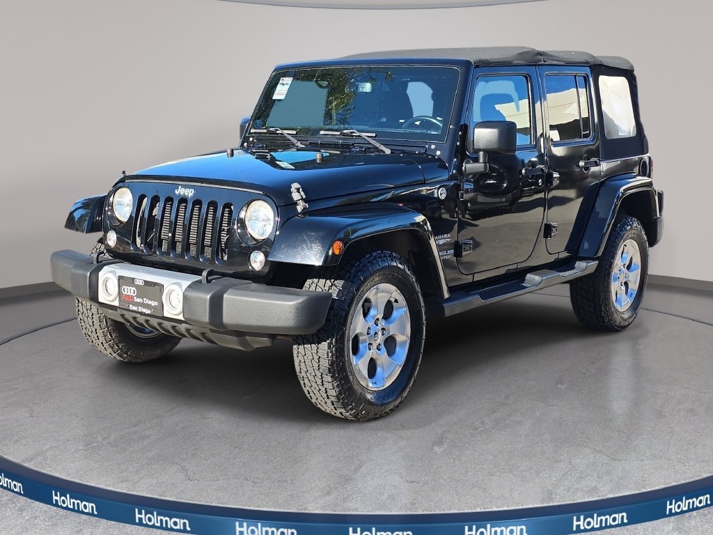 Used 2015 Black Jeep Unlimited Sahara image 1