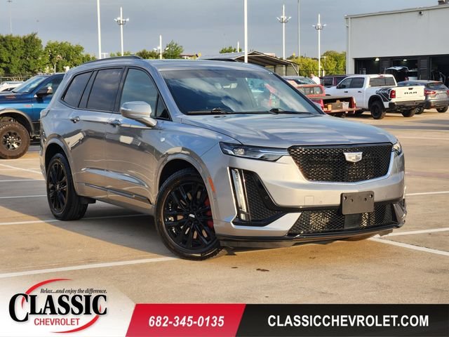 Used 2024 Argent Silver Metallic Cadillac Sport image 1