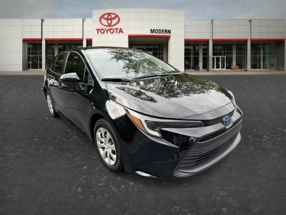 Used 2024 Midnight Black Metallic Toyota Hybrid LE image 6
