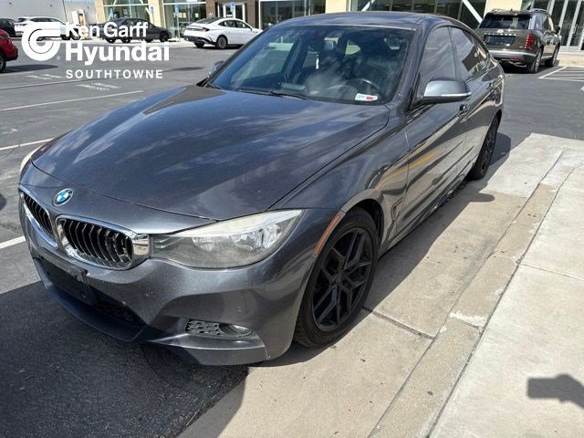 Used 2016 Mineral Grey Metallic BMW 328i xDrive image 1