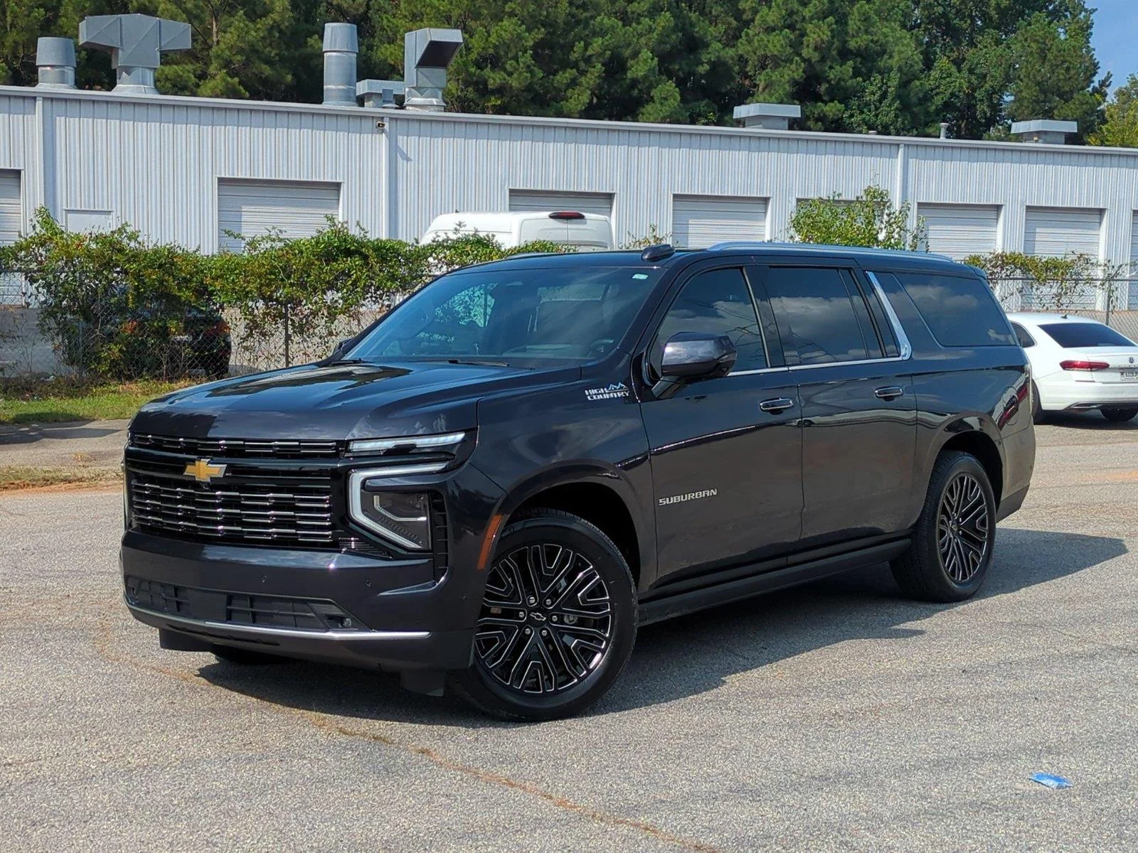 Used 2025 Lakeshore Blue Metallic Chevrolet High Country image 1