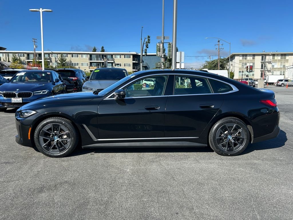 Certified Used 2023 Black Sapphire Metallic BMW eDrive40 image 2