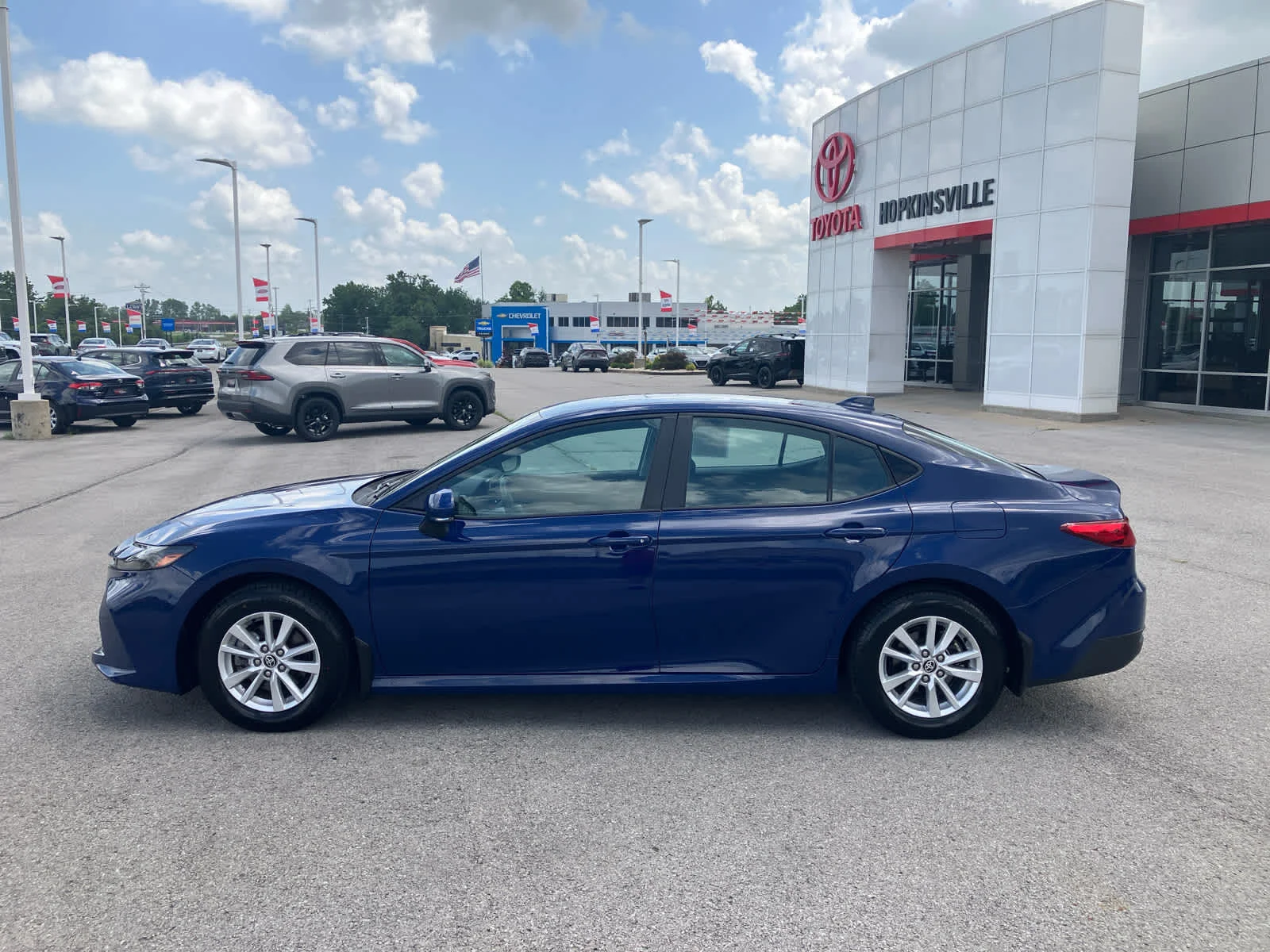 Used 2025 Reservoir Blue Toyota LE image 4