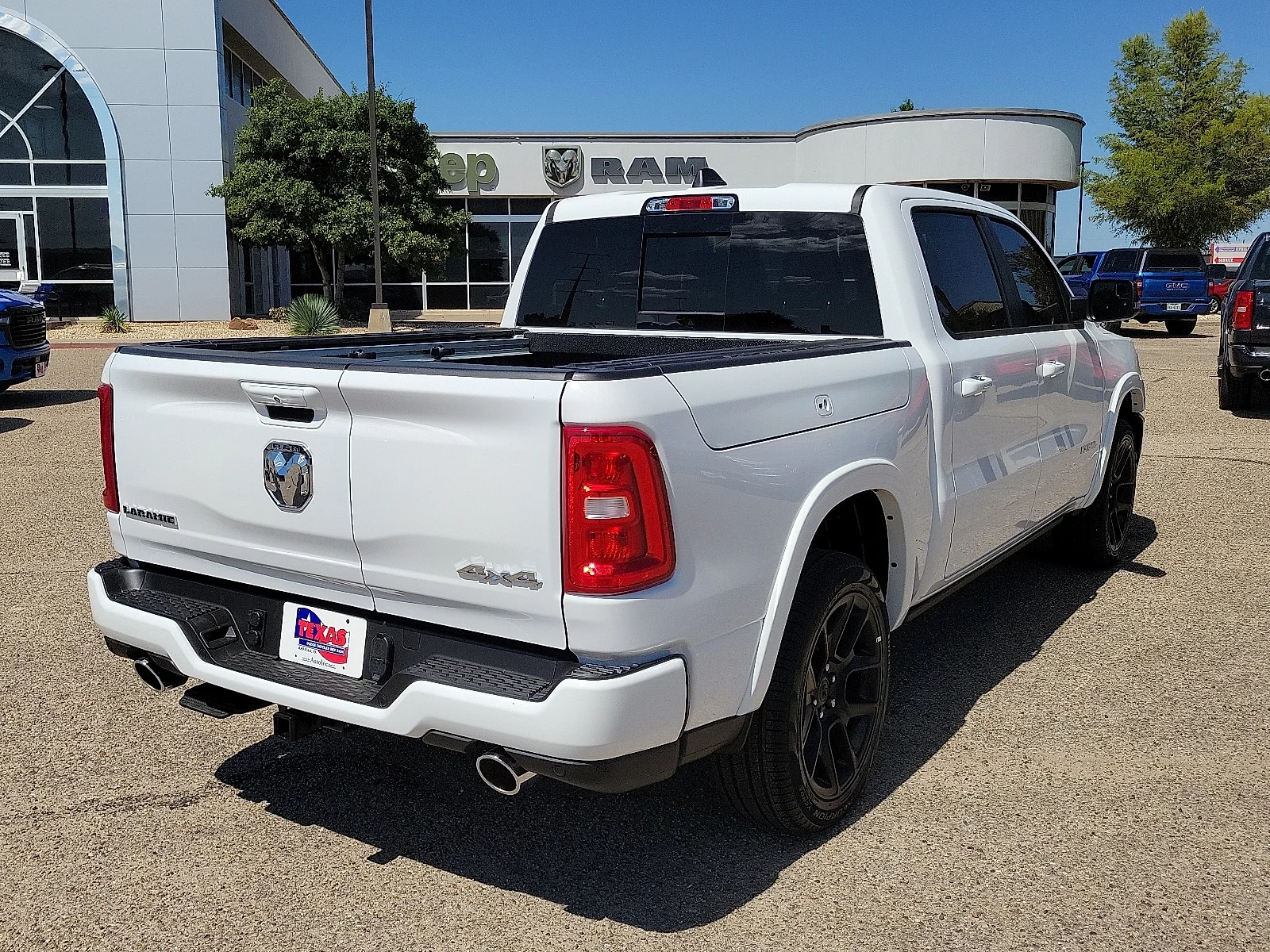 New 2026 PW7 Bright Whit Ram LARAMIE CREW CAB 4X4 5