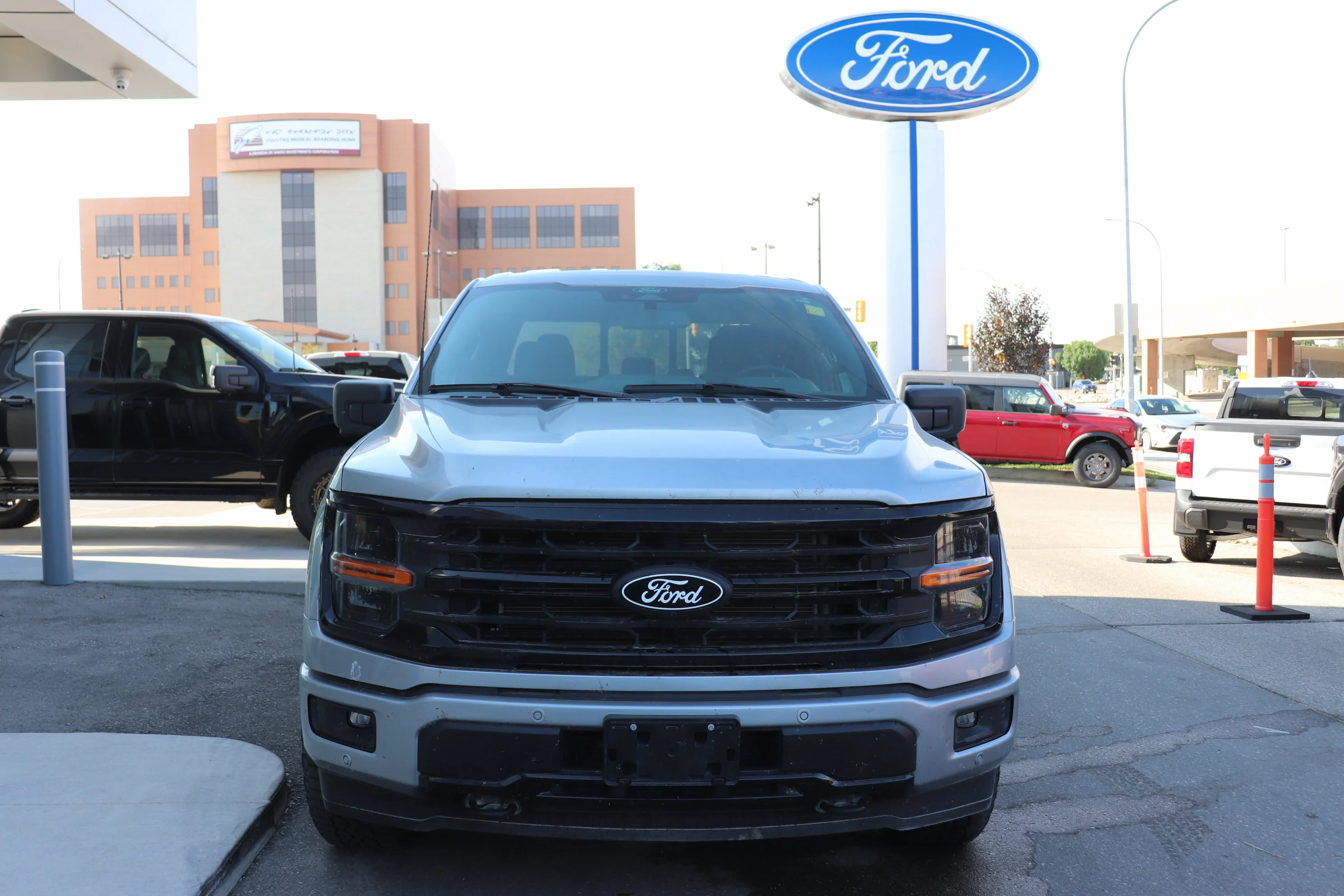 Used 2024 Silver Ford XLT 4WD SuperCrew 5.5