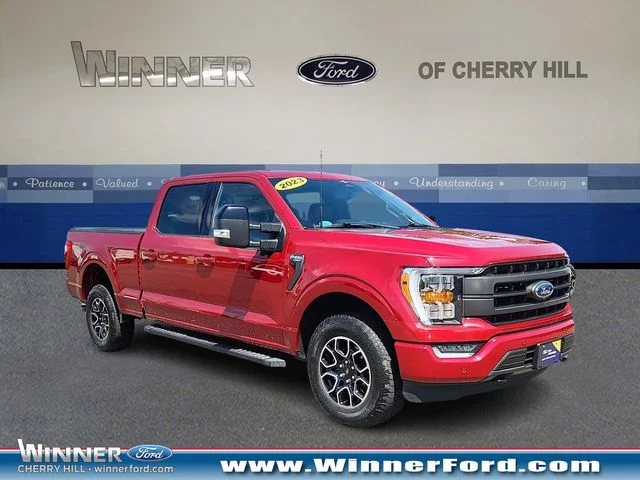 Certified Used 2023 Rapid Red Metallic Tinted Clearcoat Ford Lariat image 1