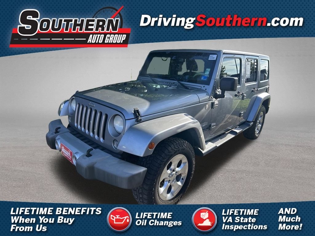 Used 2014 Gray Jeep Unlimited Sahara image 1