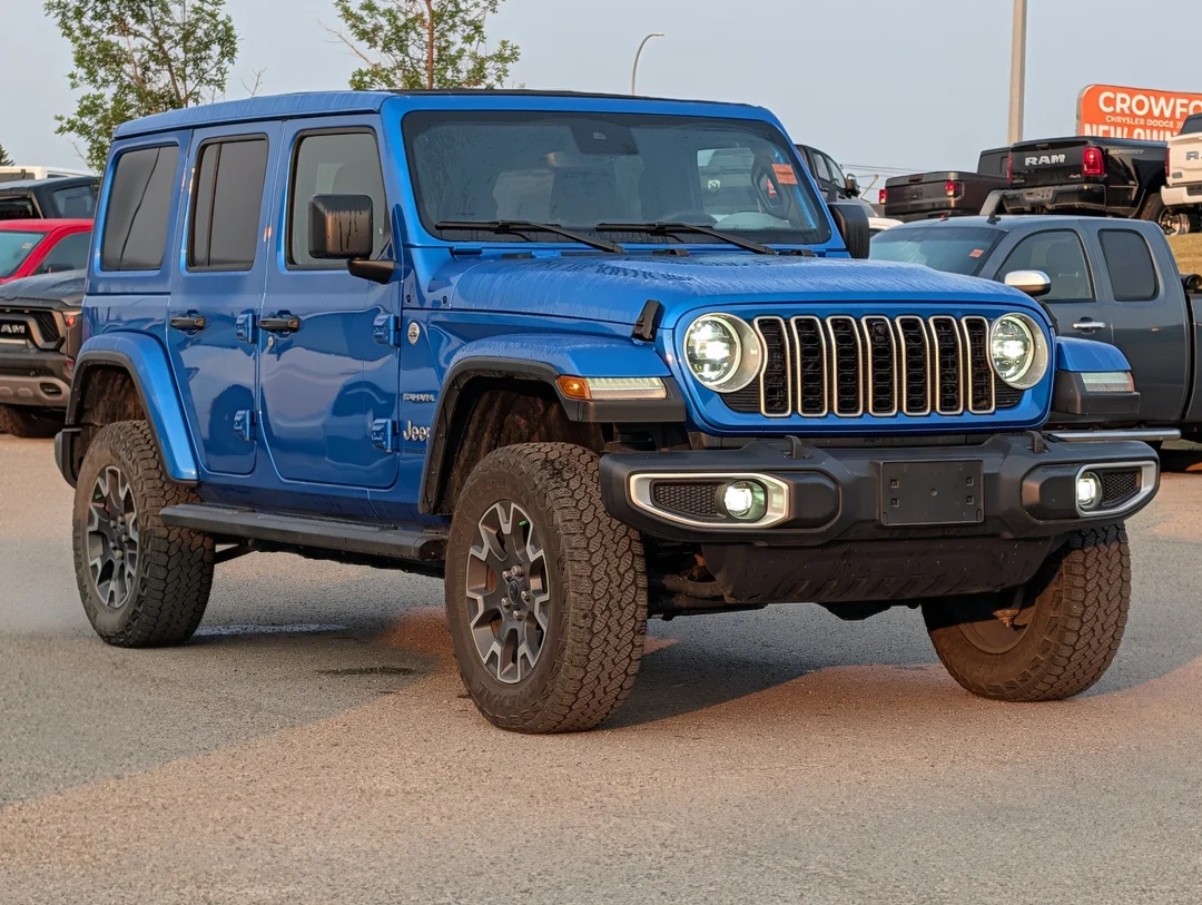 Used 2024 Blue Jeep Sahara - - 4x4 - Leather Seats - Power Soft Top - Remote Start & More! image 2
