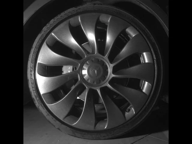 Used 2023 Solid Black Tesla Performance image 19