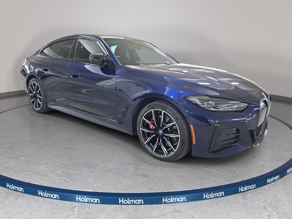 Used 2023 Tanzanite Blue II Metallic BMW eDrive40 image 4