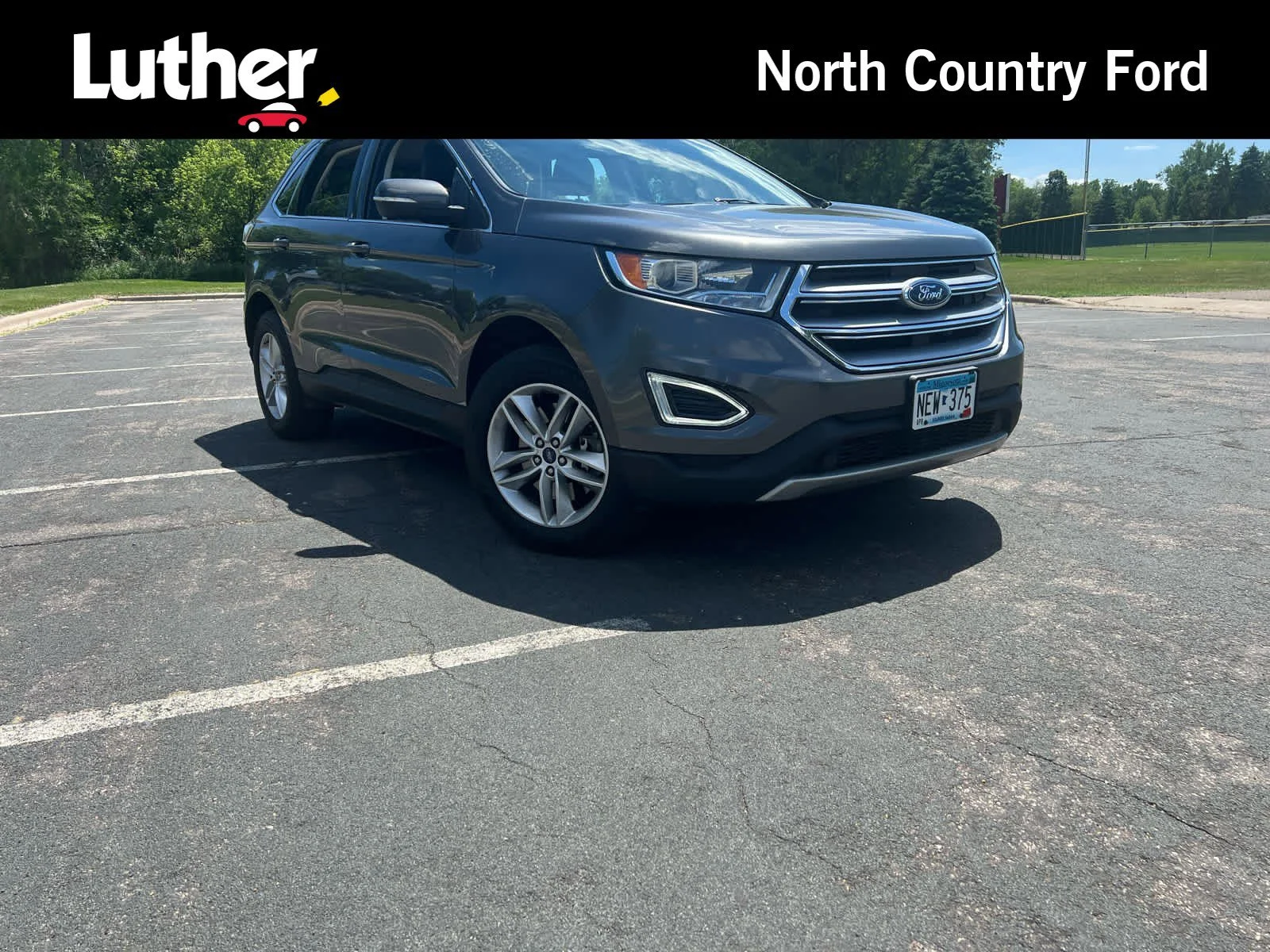 Used 2015 Magnetic Metallic Ford SEL image 1