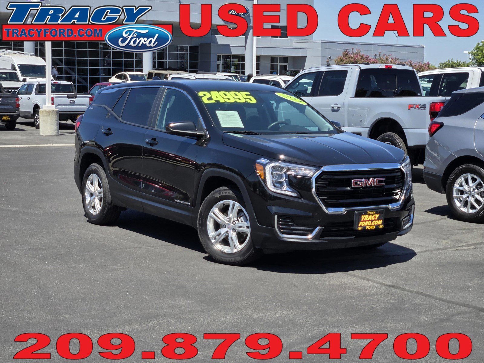 Used 2024 Ebony Twilight Metallic GMC SLE image 1
