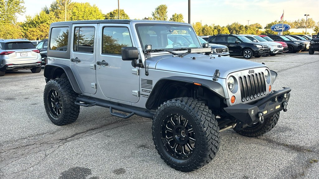 Used 2013 Billet Clearcoat Metallic Jeep Unlimited Sport image 21