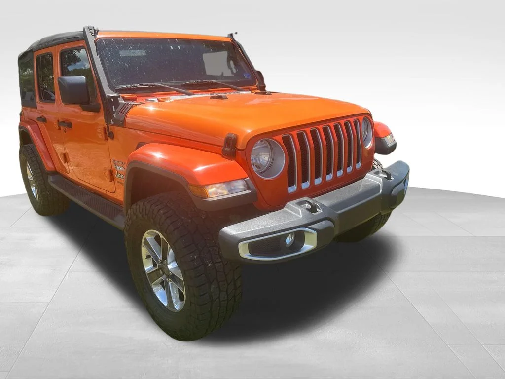 Used 2018 Orange Jeep Unlimited Sahara image 31