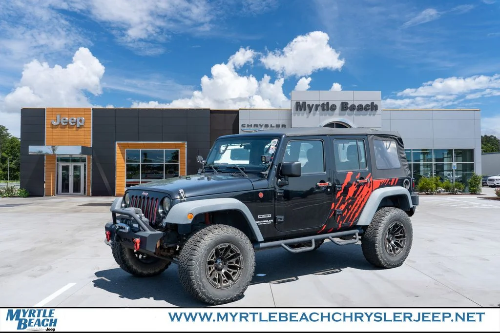 Used 2015 Black Clearcoat Jeep Unlimited Sport image 1