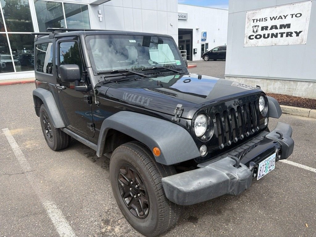Used 2016 Black Clearcoat Jeep Sport image 1