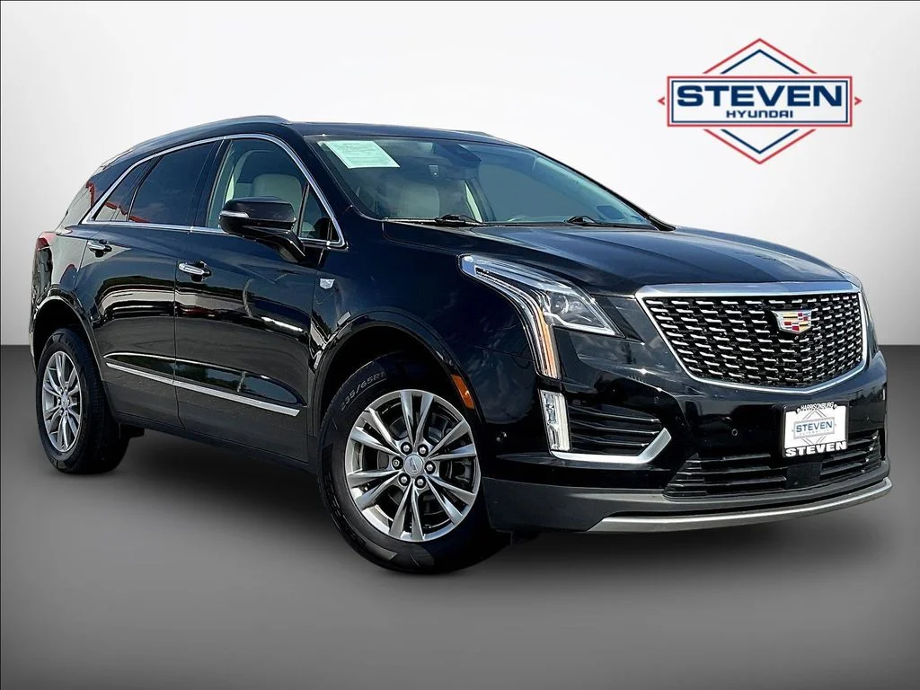 Used 2021 Black Cadillac Premium Luxury image 1