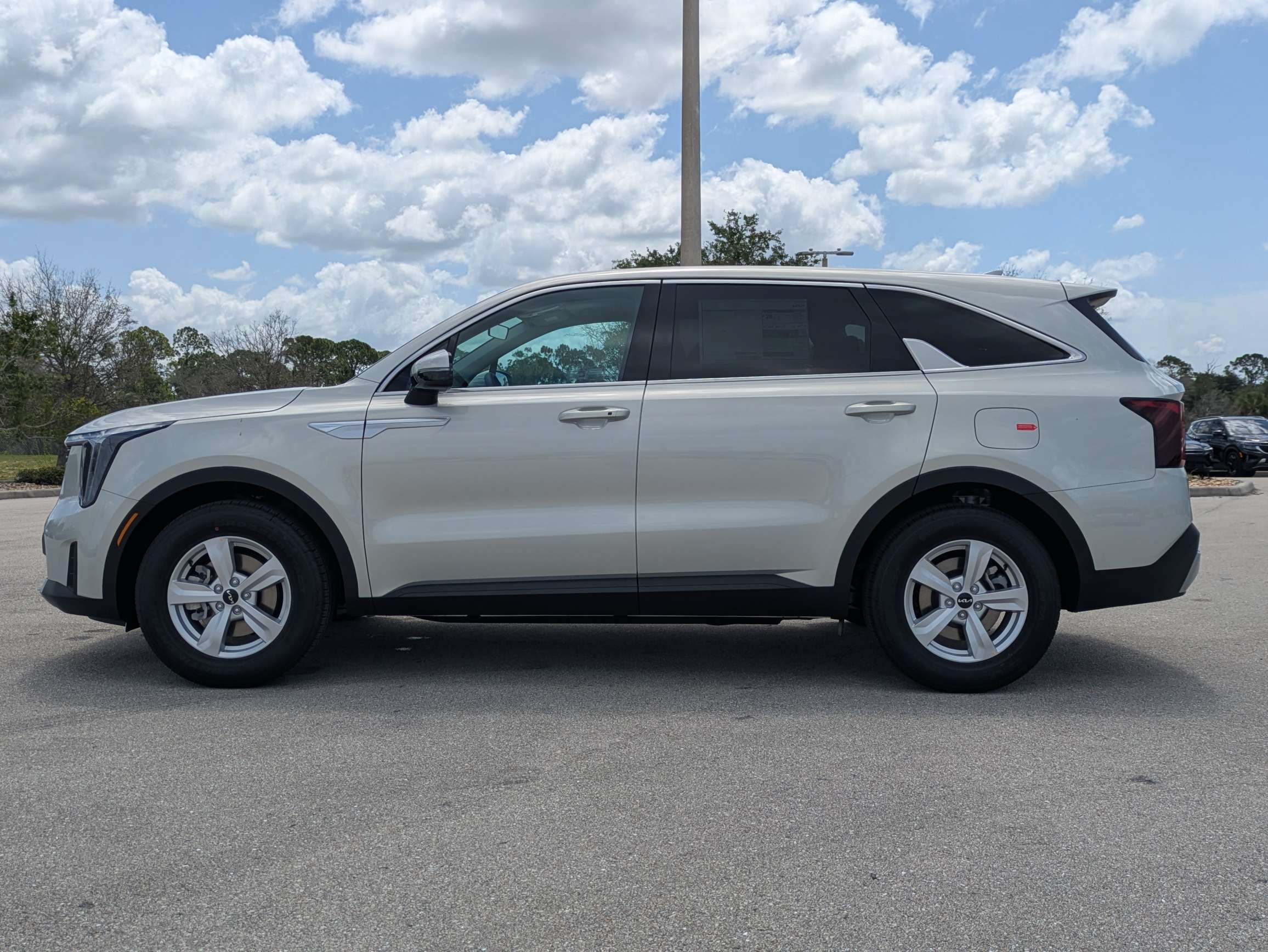 New 2026 Ivory Silver Kia LX image 8