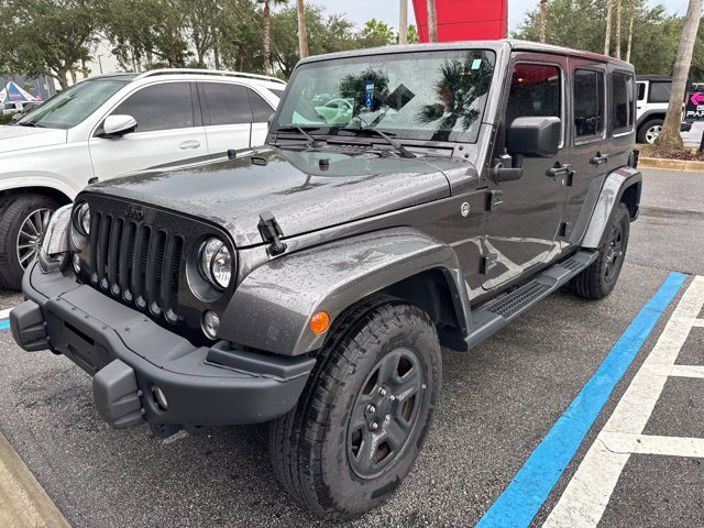 Used 2016 Gray Jeep Unlimited Sahara image 1