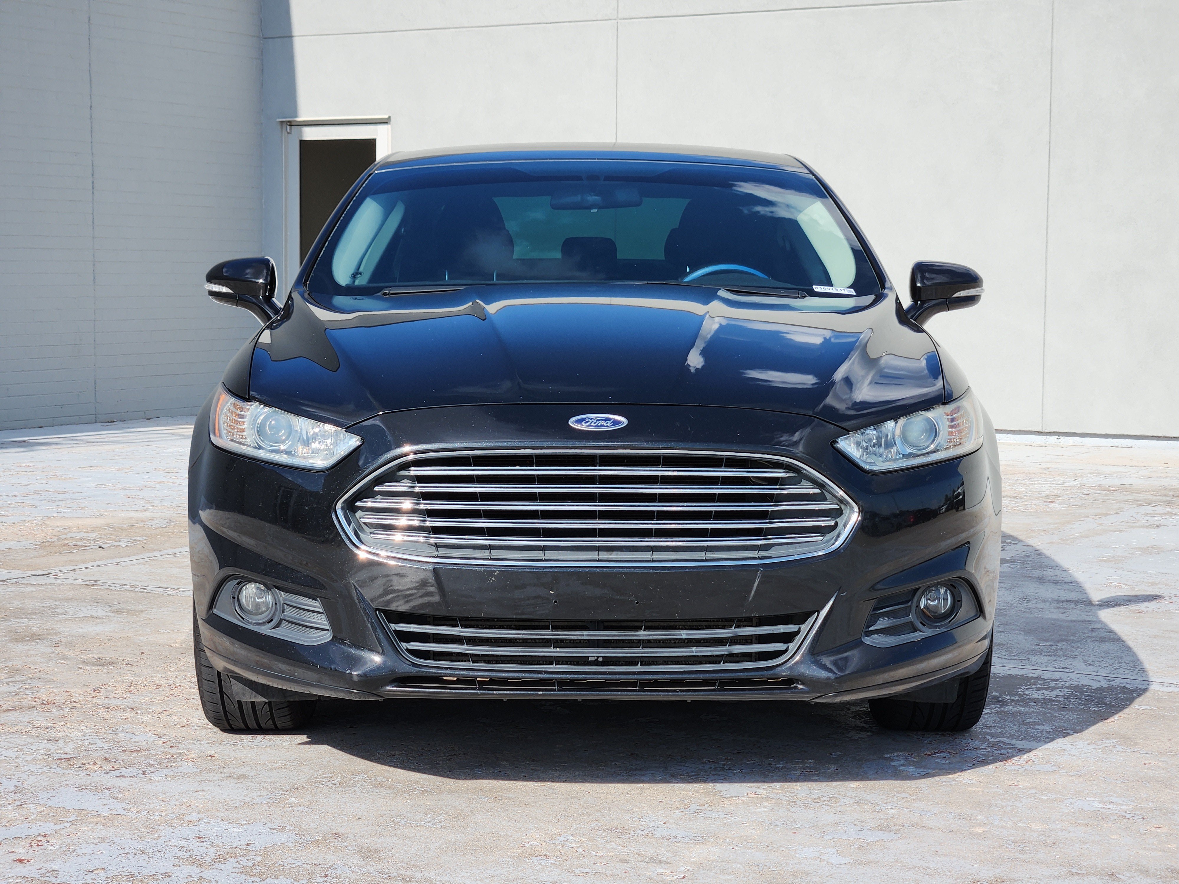 Used 2013 Tuxedo Black Metallic Ford SE image 2