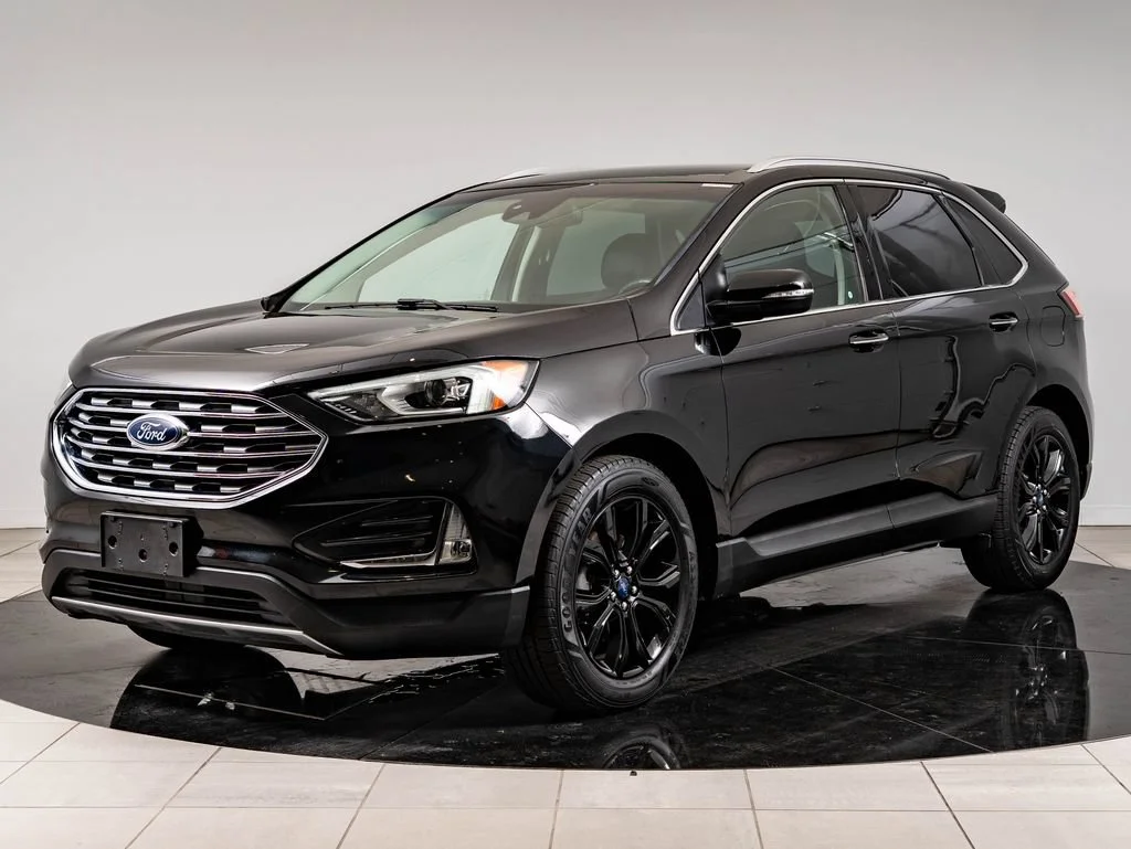 Used 2019 Agate Black Metallic Ford Titanium image 1