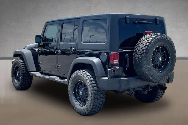 Used 2013 Black Jeep Unlimited Sport image 8
