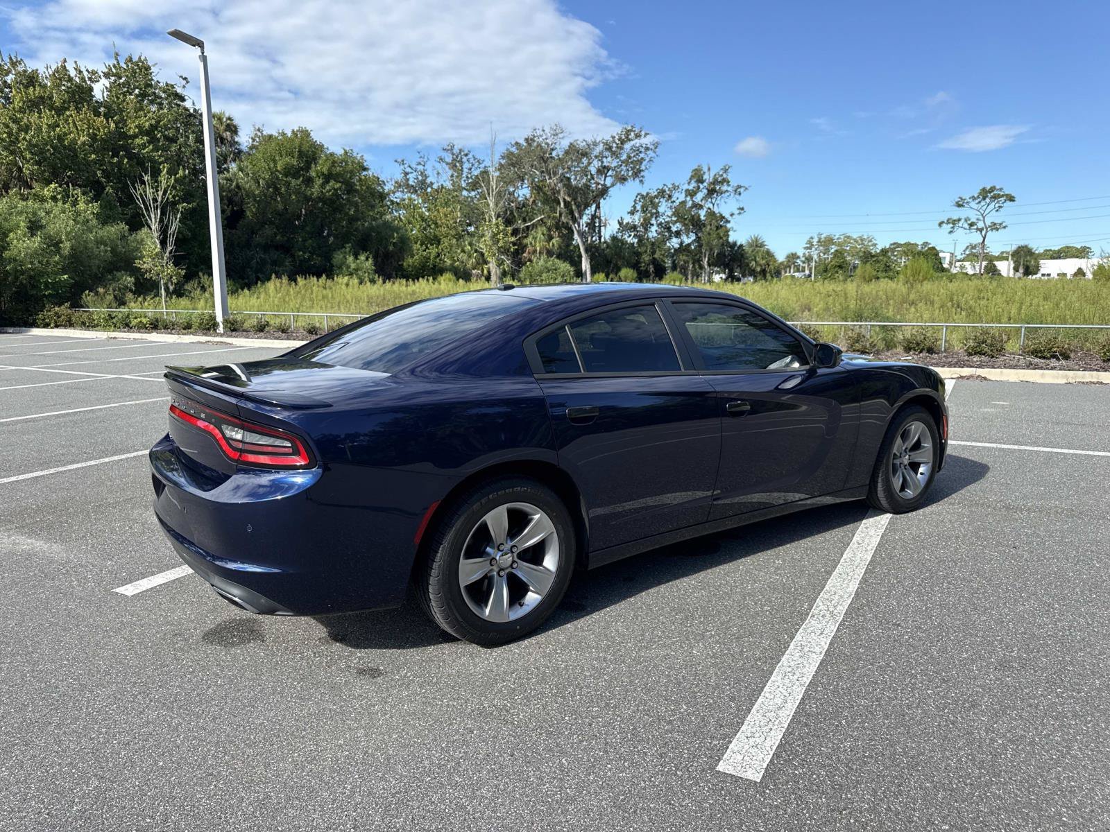 Used 2015 Dodge Charger SE with VIN 2C3CDXBG7FH874715 for sale in New Smyrna Beach, FL